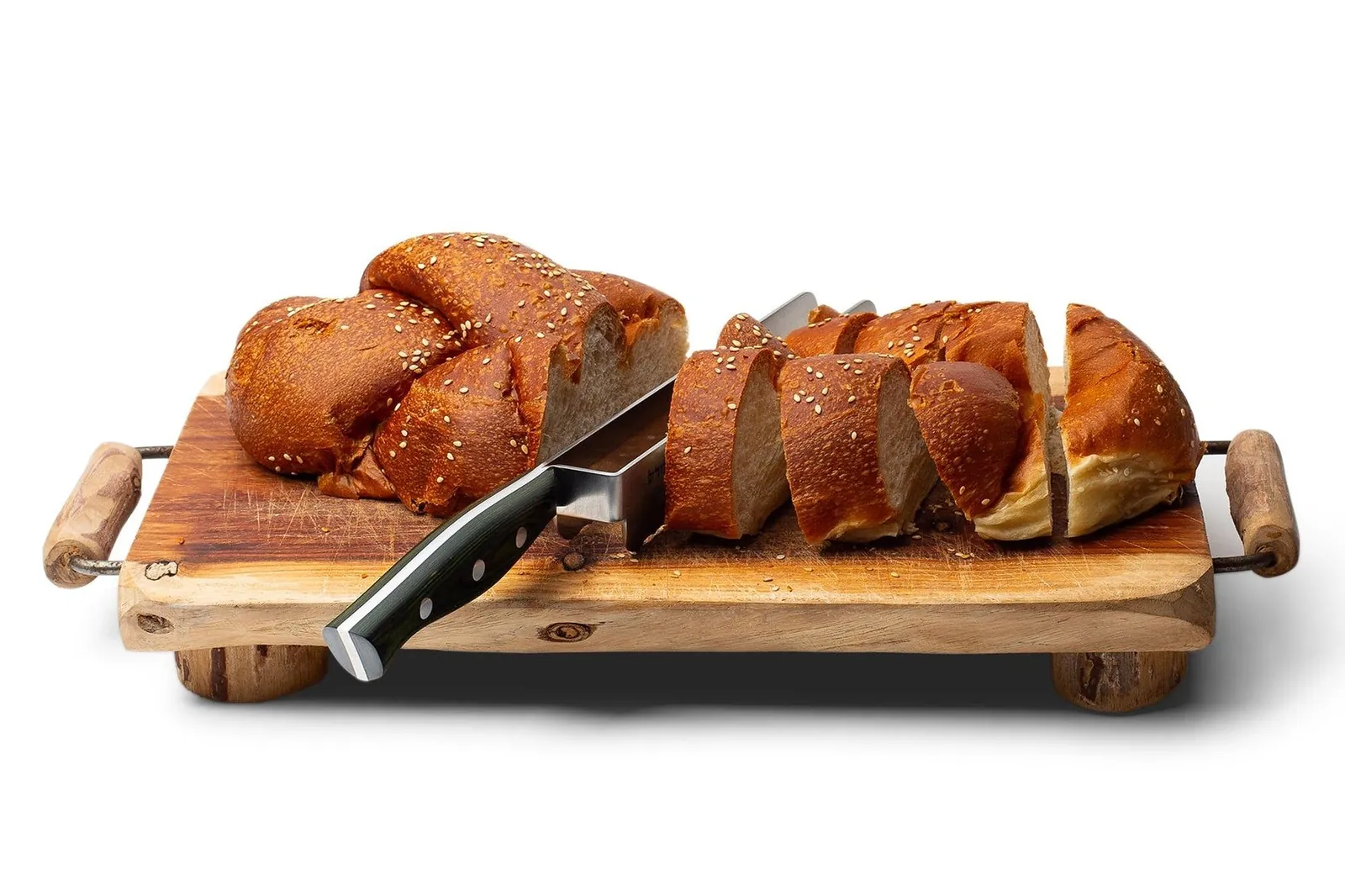 Challah sliced on a wooden board