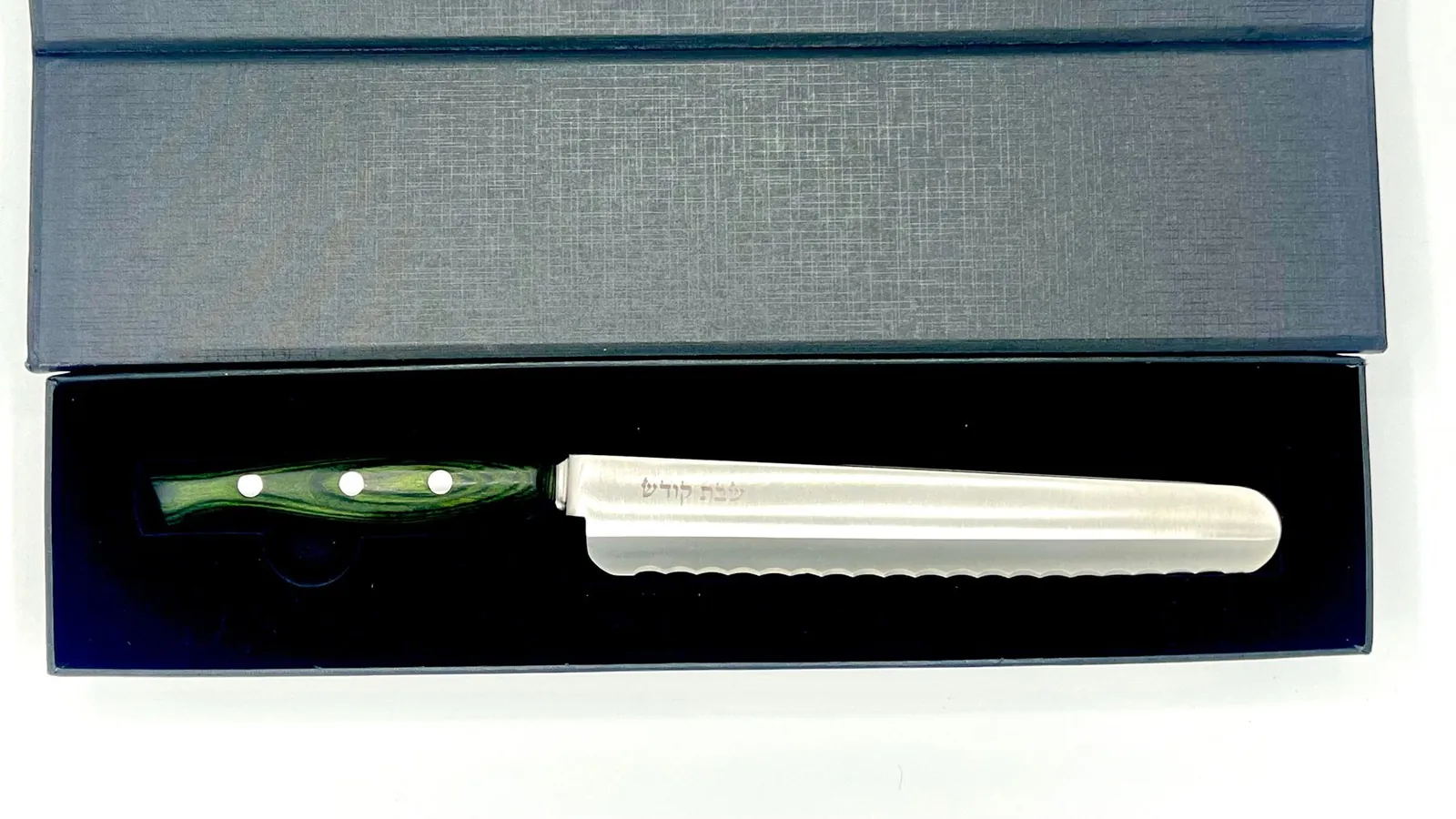 The green-handled knife in its presentation box